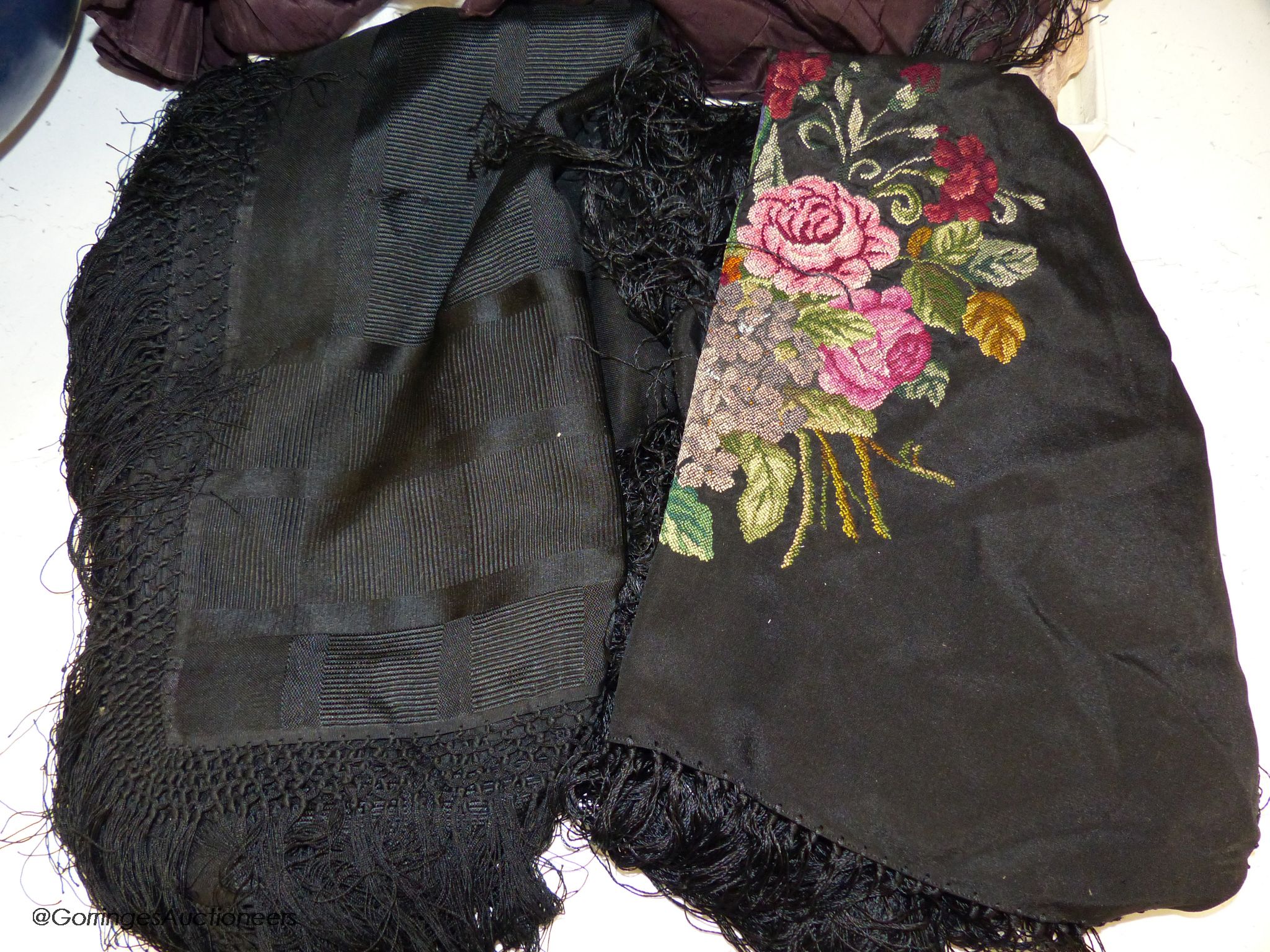 A Victorian black silk jacket and skirt, a child's white lawn dress, a black silk fringed petite point shawl and a fine silk shawl etc